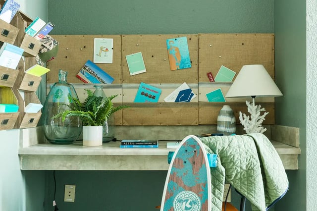 Desk with bulletin board and items study area at The Holly in Lubbock Student Accommodation