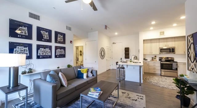 Sofa coffee table and modern kitchen living room at Sterling 5th Street in Davis Student Accommodation