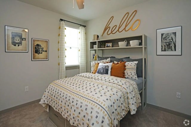 Bed with pillows shelf and decor bedroom at The Finmore at 241 in Boone Student Accommodation