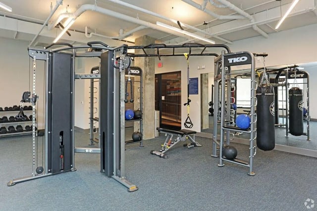 Gym equipment with punching bags and weights Gym area at The Finmore at 241 in Boone Student Accommodation