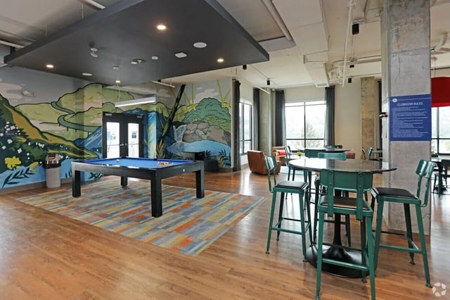 Pool table colorful rug lounge area common room at The Finmore at 241 in Boone Student Accommodation