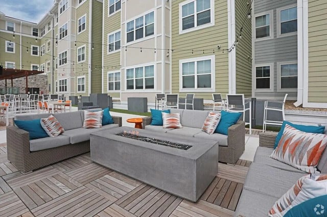 Sofa fire pit patio seating exterior at The Finmore at 241 in Boone Student Accommodation