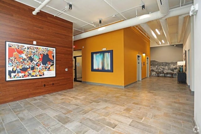 Abstract art and map art in hallway common area at The Finmore at 241 in Boone Student Accommodation