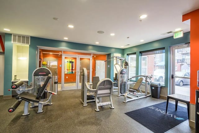 Weight machines in a modern gym area. at The Avenue Indianapolis in Indianapolis Student Accommodation