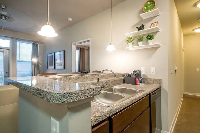 Kitchen counter sink and cabinets kitchen at The Avenue Indianapolis in Indianapolis Student Accommodation