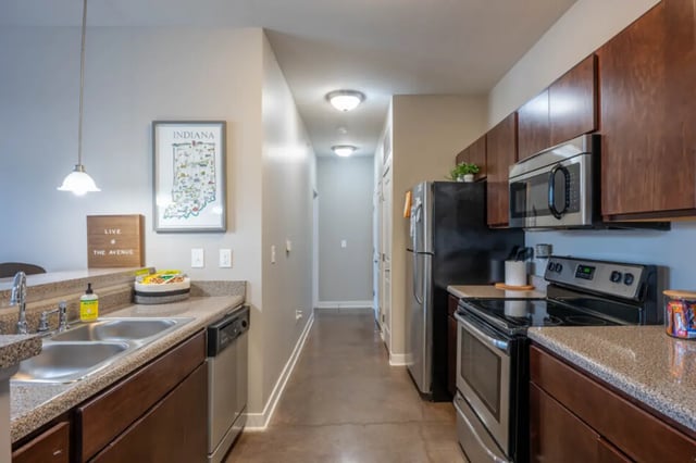 Kitchen with sink, refrigerator, and oven kitchen at The Avenue Indianapolis in Indianapolis Student Accommodation
