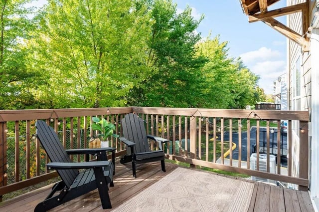 Two chairs rug on wooden deck exterior at Redpoint West Lafayette in West Lafayette Student Accommodation