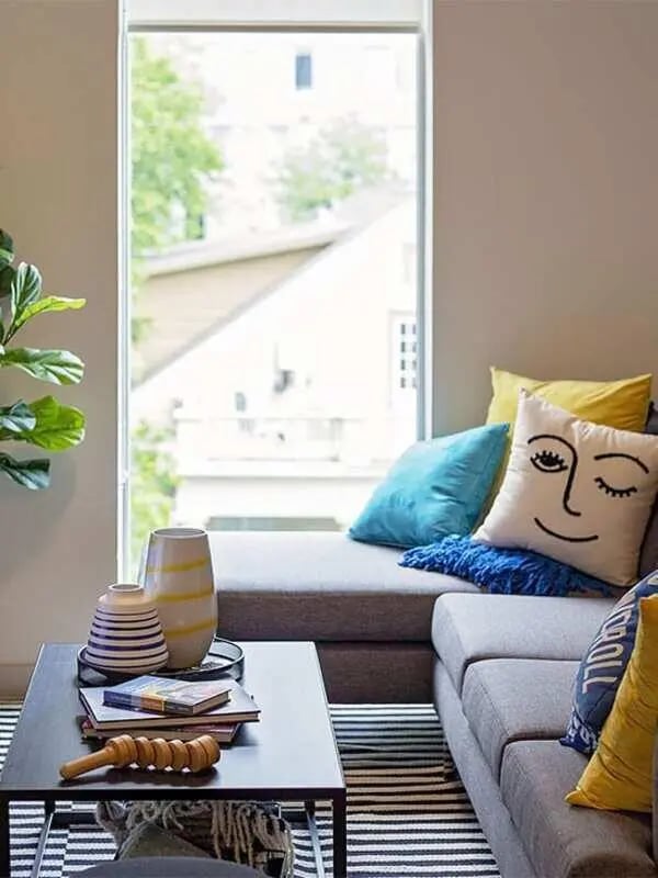 Sofa with pillows and coffee table living room at Lark Austin in Austin Student Accommodation