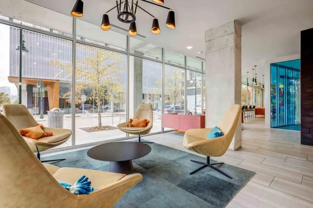 Modern chairs and coffee table in lounge living room at Lark Austin in Austin Student Accommodation