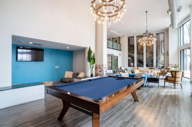 Billiard table modern lounge living room at Northpoint Crossing in College Station Student Accommodation
