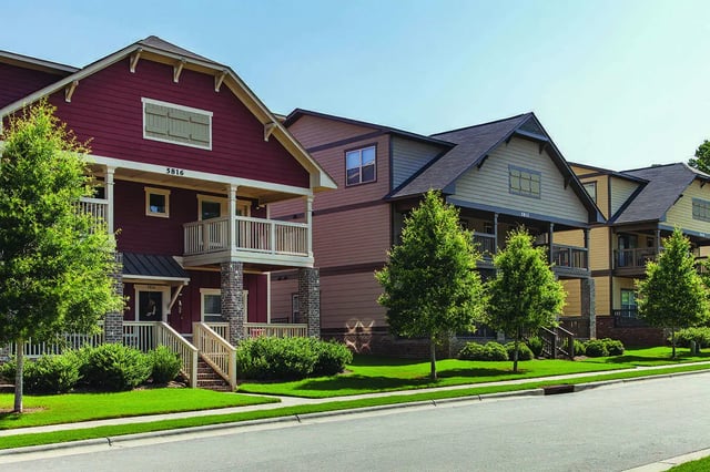 Apartment buildings with porches balconies trees exterior at Redpoint in Raleigh Student Accommodation