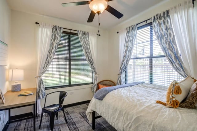 Bed desk chair patterned curtains bedroom at Lark Oxford in Oxford Student Accommodation