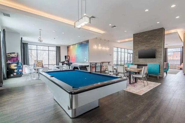 Pool table arcade games lounge area living room at Lark Syracuse in Syracuse Student Accommodation
