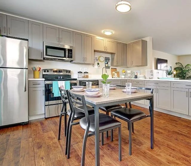 Kitchen table with chairs and stainless steel appliances kitchen at Lark West Lafayette in West Lafayette Student Accommodation
