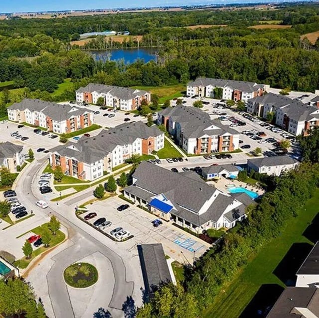 Apartment buildings with pool and parking exterior at Lark West Lafayette in West Lafayette Student Accommodation