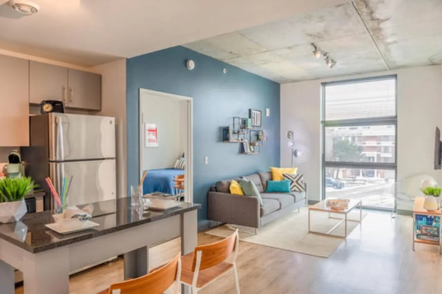 Kitchen living room with sofa and bed visible. at Lark at Kohl in Madison Student Accommodation