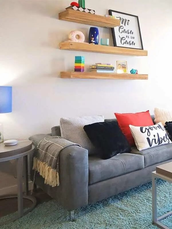 Gray sofa shelves with decor living room at Lark in the Woods in Tuscaloosa Student Accommodation