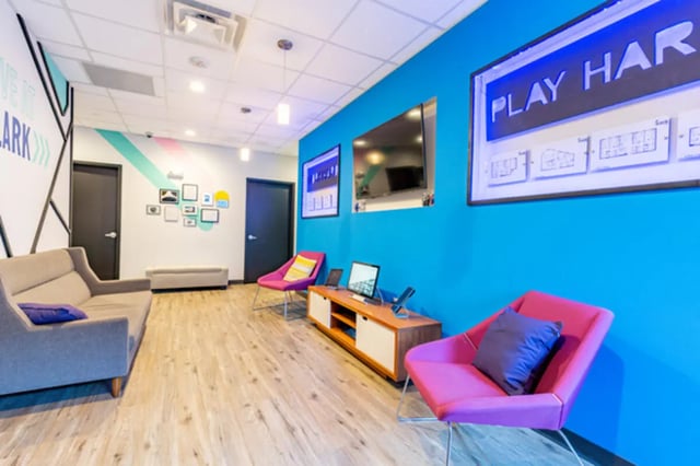 Sofa chairs media console television play area at Lark on Main in Charlottesville Student Accommodation