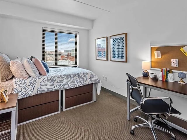 Bed desk and artwork bedroom study area at Chestnut Square in Philadelphia Student Accommodation