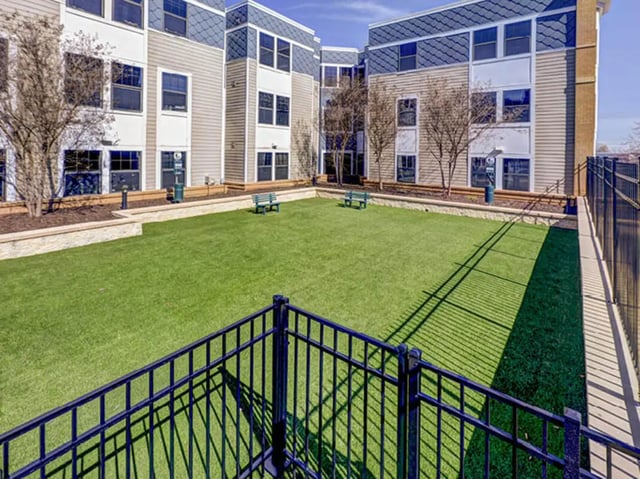 Grass area with benches and building exterior at 1200 West Marshall in Richmond Student Accommodation