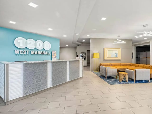 Reception desk with seating area Lobby at 1200 West Marshall in Richmond Student Accommodation