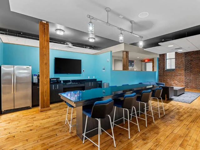 Stainless steel fridge counter and bar seating living room at 1200 West Marshall in Richmond Student Accommodation
