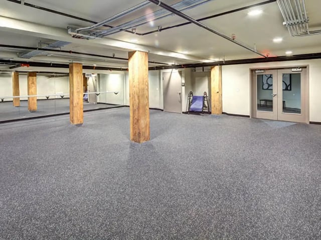 Gym with mirrors and exercise equipment playing area at 1200 West Marshall in Richmond Student Accommodation