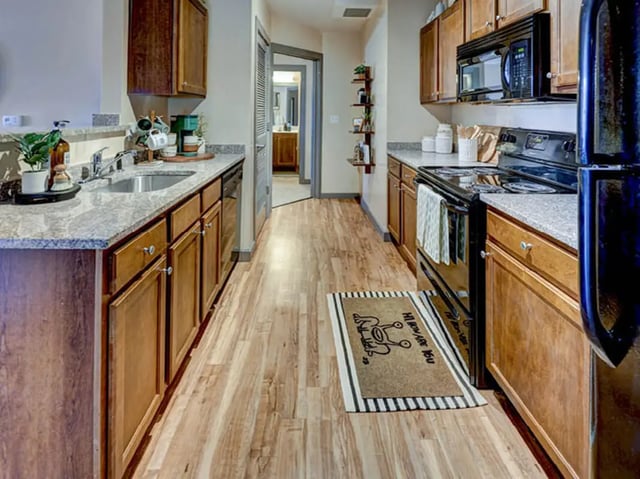 Kitchen with cabinets countertop appliances and mat kitchen at 1200 West Marshall in Richmond Student Accommodation