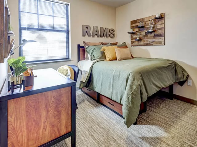 Bed desk and wall decor bedroom at 1200 West Marshall in Richmond Student Accommodation