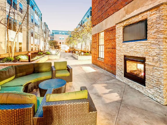 Outdoor seating and fireplace exterior at 1200 West Marshall in Richmond Student Accommodation