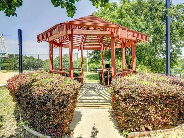 Wooden gazebo surrounded by bushes outdoor area at City Parc at Fry Street in Denton Student Accommodation