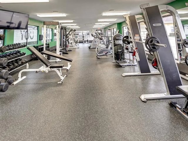 Weight benches dumbbells and exercise machines gym at City Parc at Fry Street in Denton Student Accommodation