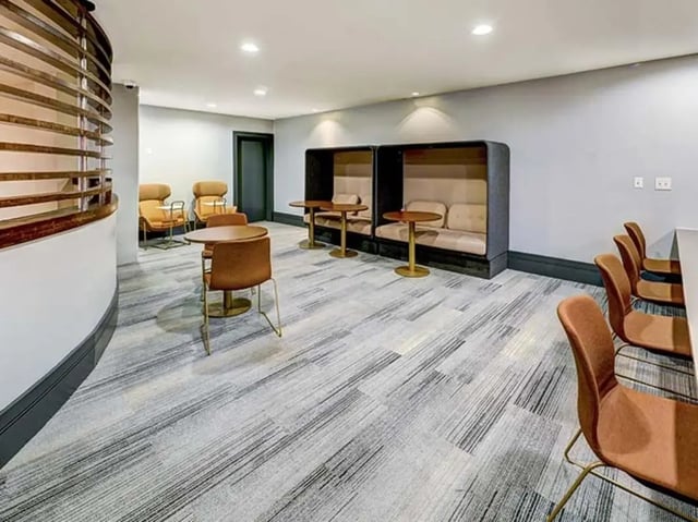 Booth seating tables and chairs communal area at Crest at Pearl in Austin Student Accommodation