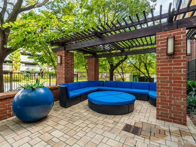 Circular seating area under pergola outdoor lounge area at 601 Copeland in Tallahassee Student Accommodation
