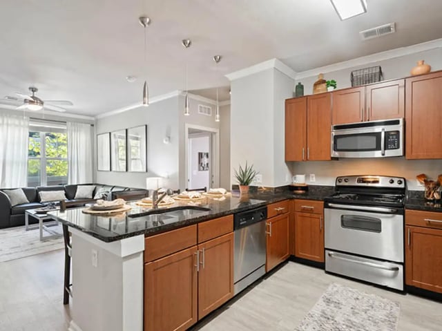 Island sink dishwasher cabinets oven microwave kitchen at 601 Copeland in Tallahassee Student Accommodation