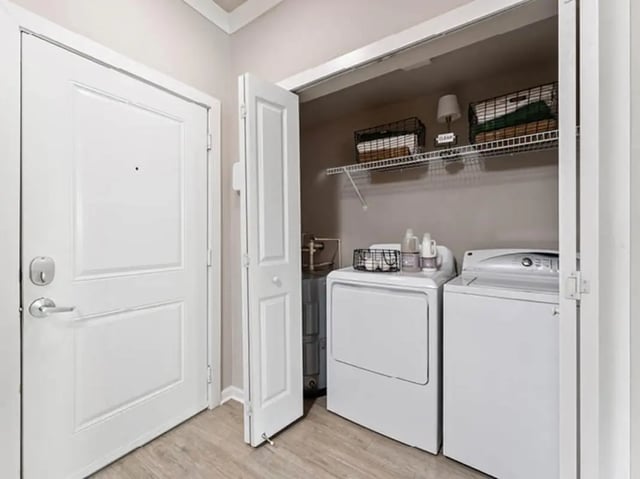 Washer dryer stack with shelves Laundry Room at 601 Copeland in Tallahassee Student Accommodation