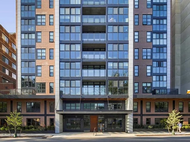 Modern apartment building with glass balconies and brick exterior exterior at Campus Edge Ann Arbor in Ann Arbor Student Accommodation