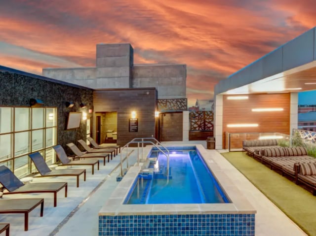 Pool loungers and small pool outdoors exterior at Campus Edge Ann Arbor in Ann Arbor Student Accommodation