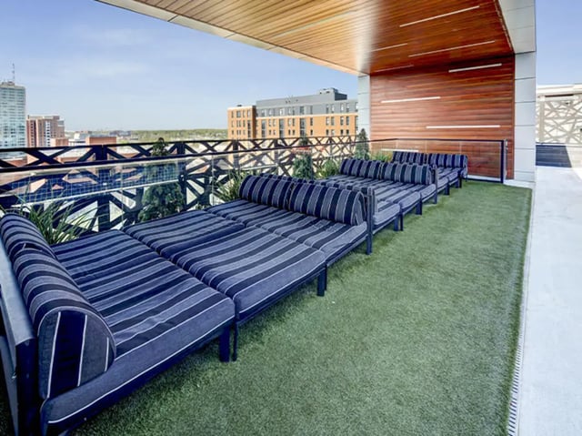 Daybeds with blue and white stripes lounge area at Campus Edge Ann Arbor in Ann Arbor Student Accommodation