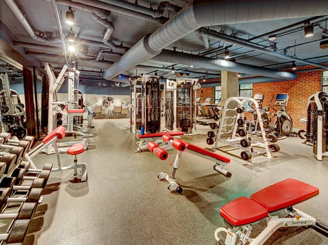 Dumbbells weight machines treadmills fitness room at Campus Edge Ann Arbor in Ann Arbor Student Accommodation