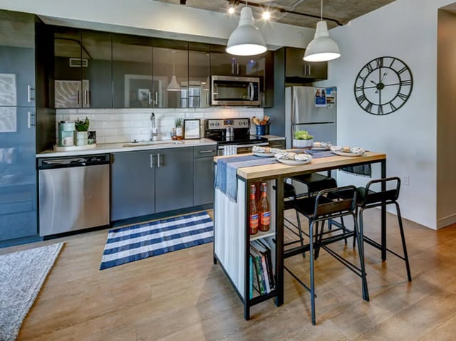 Modern kitchen with island seating and stainless steel appliances kitchen at Campus Edge Ann Arbor in Ann Arbor Student Accommodation