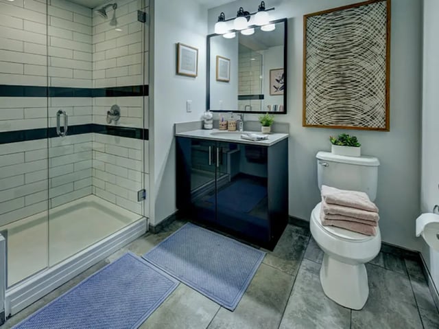 Modern bathroom with glass shower toilet vanity bathroom at Campus Edge Ann Arbor in Ann Arbor Student Accommodation