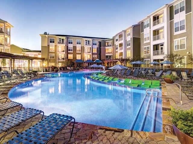 Large pool loungers apartment buildings exterior at 160 Ross in Auburn Student Accommodation