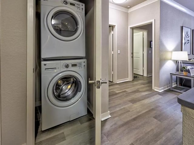 Stacked washer dryer laundry area at 160 Ross in Auburn Student Accommodation