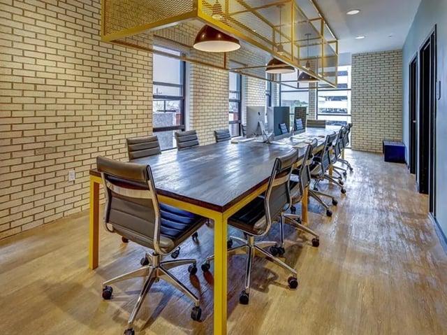 Conference table with chairs and computers study area at Campus Edge on Pierce in West Lafayette Student Accommodation