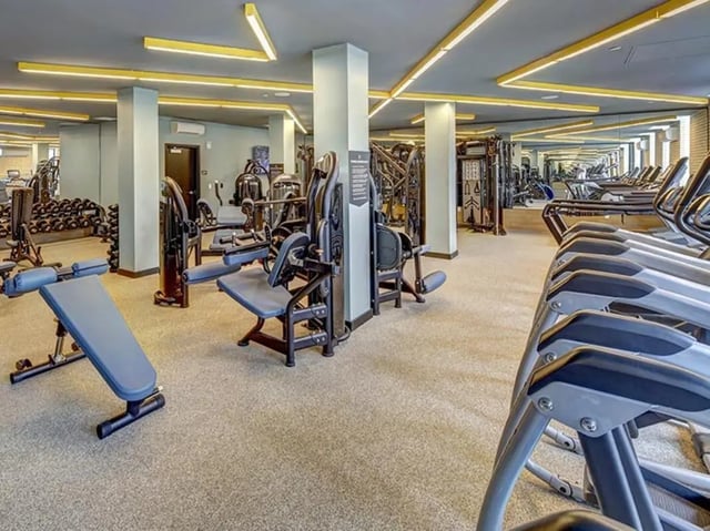 Weight machines and treadmills in gym playing area at Campus Edge on Pierce in West Lafayette Student Accommodation