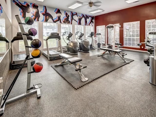 Treadmills ellipticals weight bench exercise room at Bishops Square in San Marcos Student Accommodation