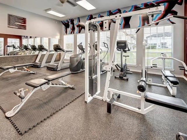 Gym with treadmills benches and weight machines gym at Bishops Square in San Marcos Student Accommodation