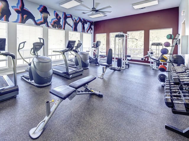 Treadmills ellipticals weight benches gym equipment exercise room at Bishops Square in San Marcos Student Accommodation