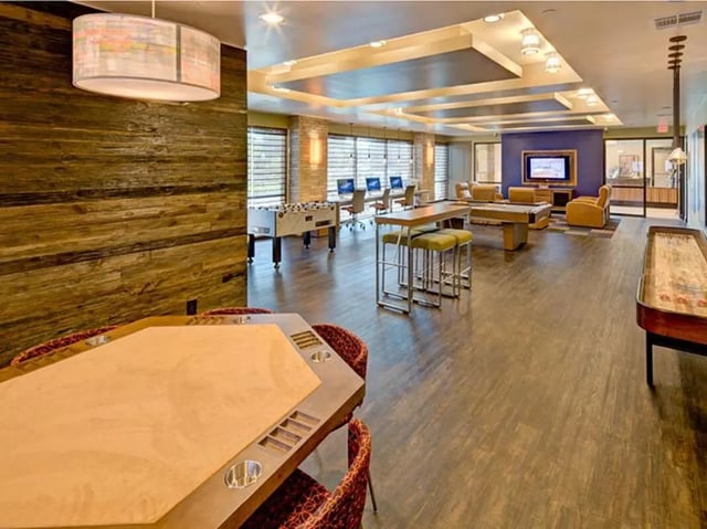 Poker table foosball table pool table lounge living area at Campus Edge on UTA Boulevard in Arlington Student Accommodation